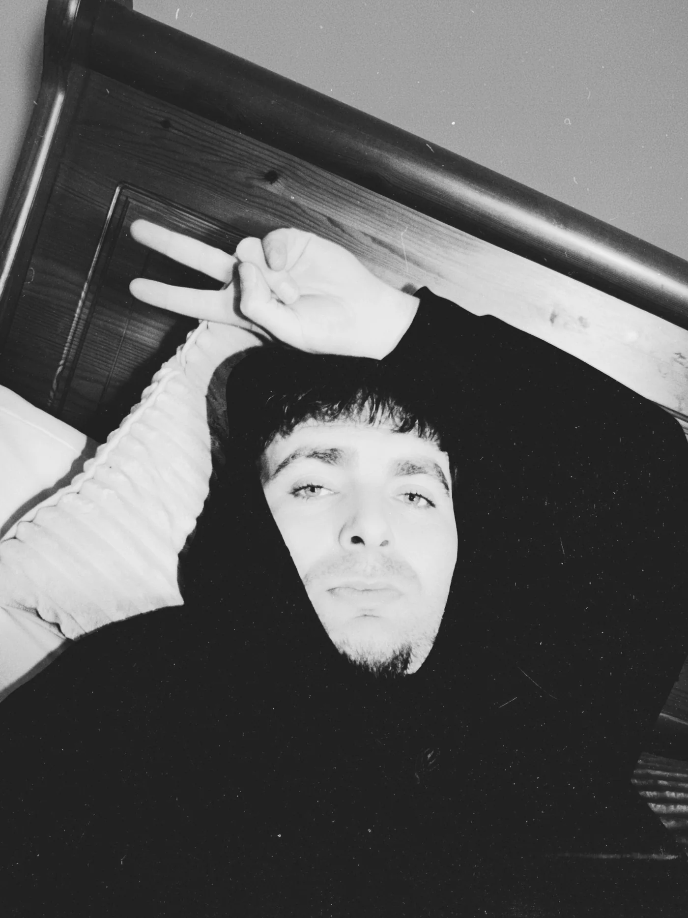 Black-and-white reclining portrait of Max Gotham