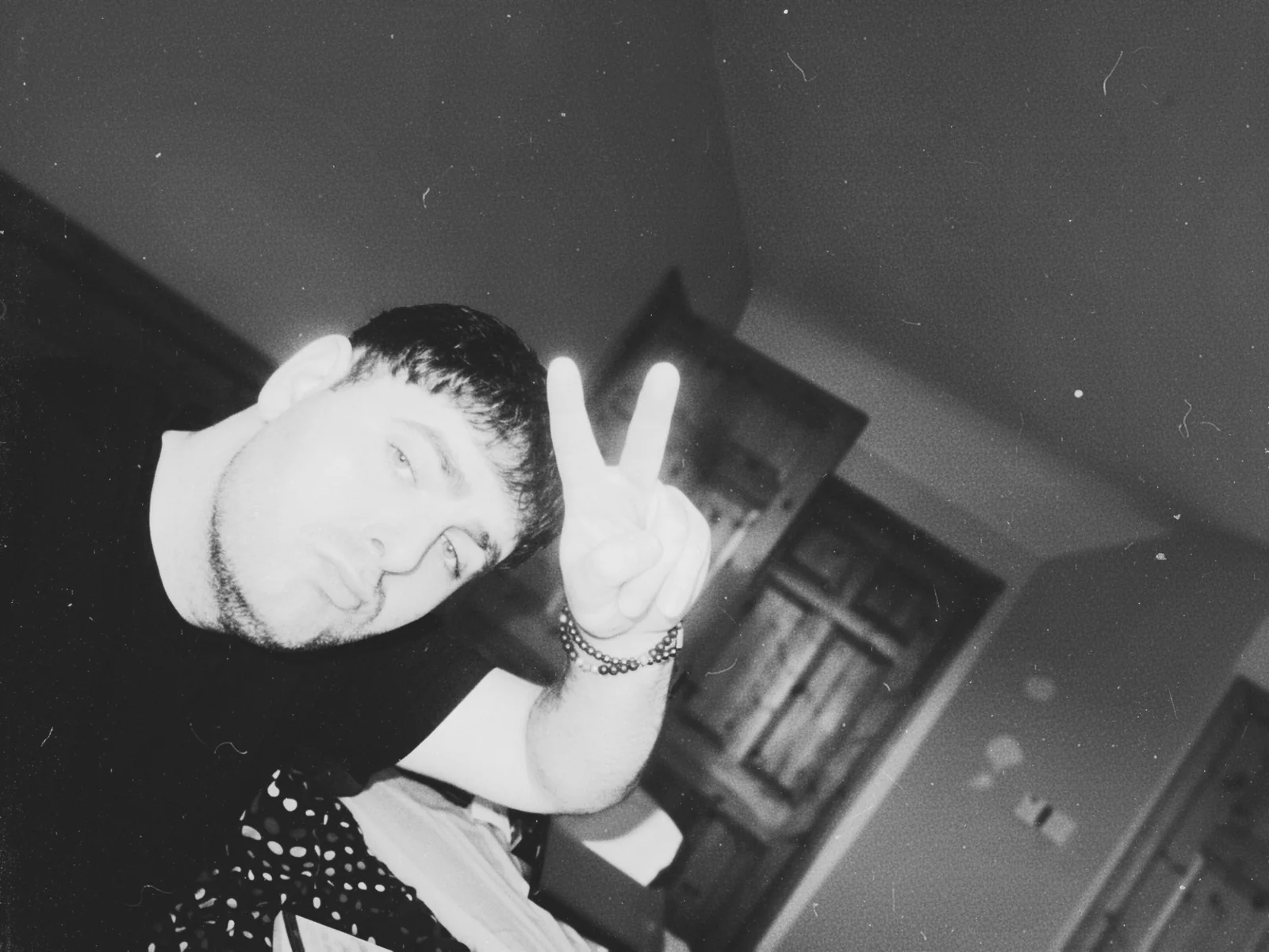 Tilted black-and-white portrait of Max Gotham